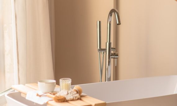 a white bath tub sitting next to a window